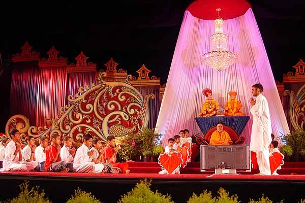 Swamishri watches the balaks' performance during the cultural program 