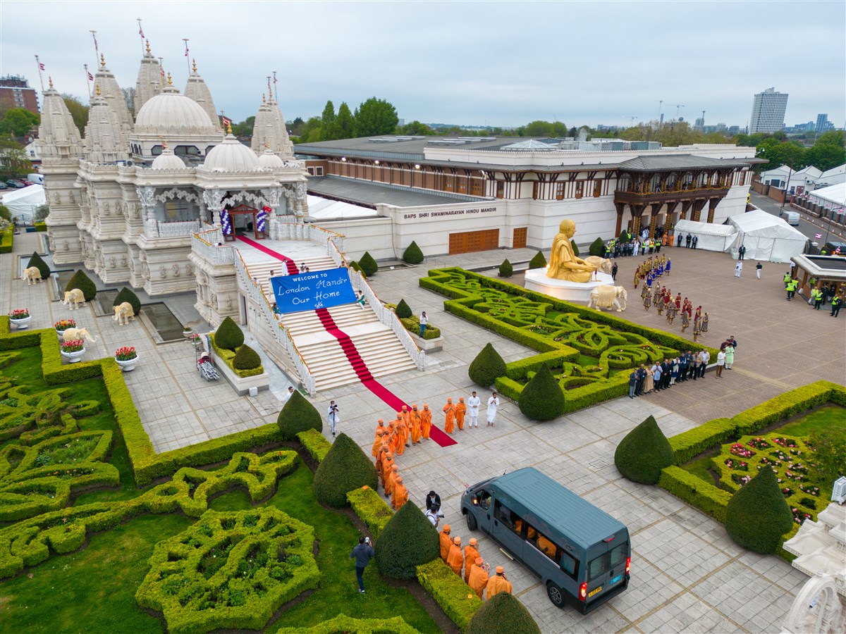 Swamis lined Swamishri's entry path as he arrived within the grounds of London Mandir