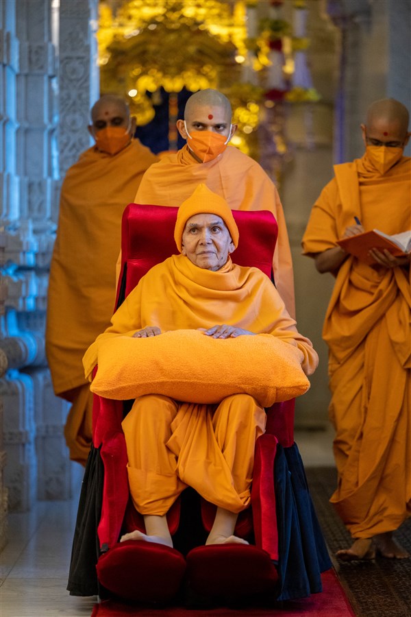 Swamishri on his way from the upper sanctum