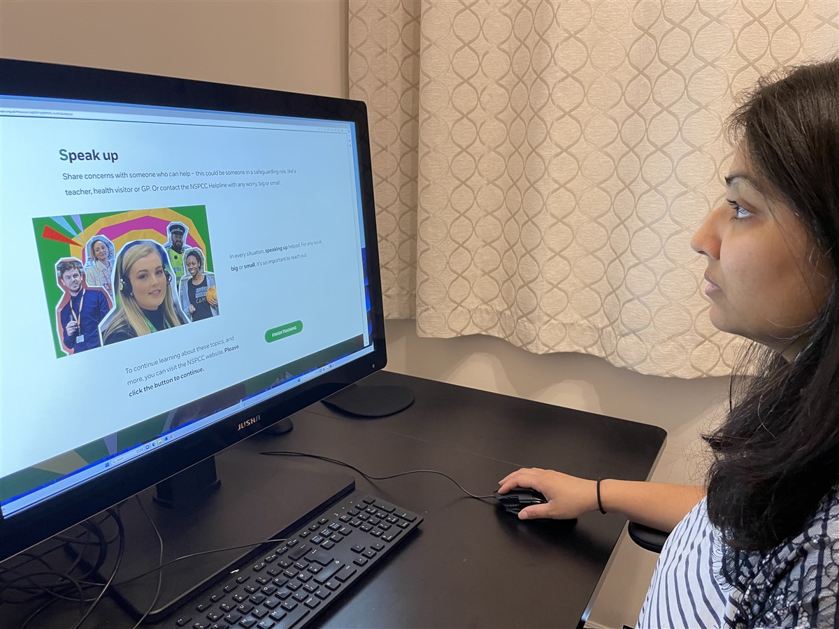A volunteer undertaking NSPCC training for children's online safety