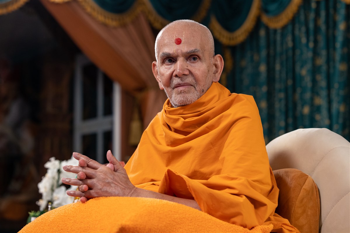 Swamishri listens attentively to the interactive programme