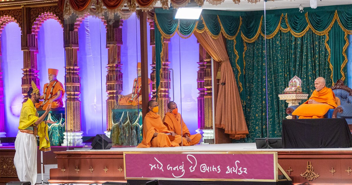 Swamishri listens attentively to the skit