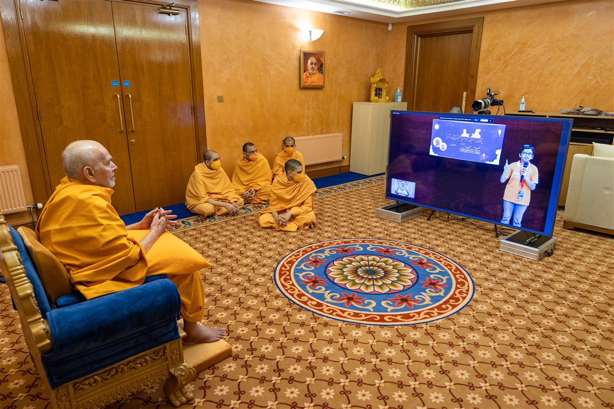 Swamishri joins a video conference call with young students from Sarangpur, India