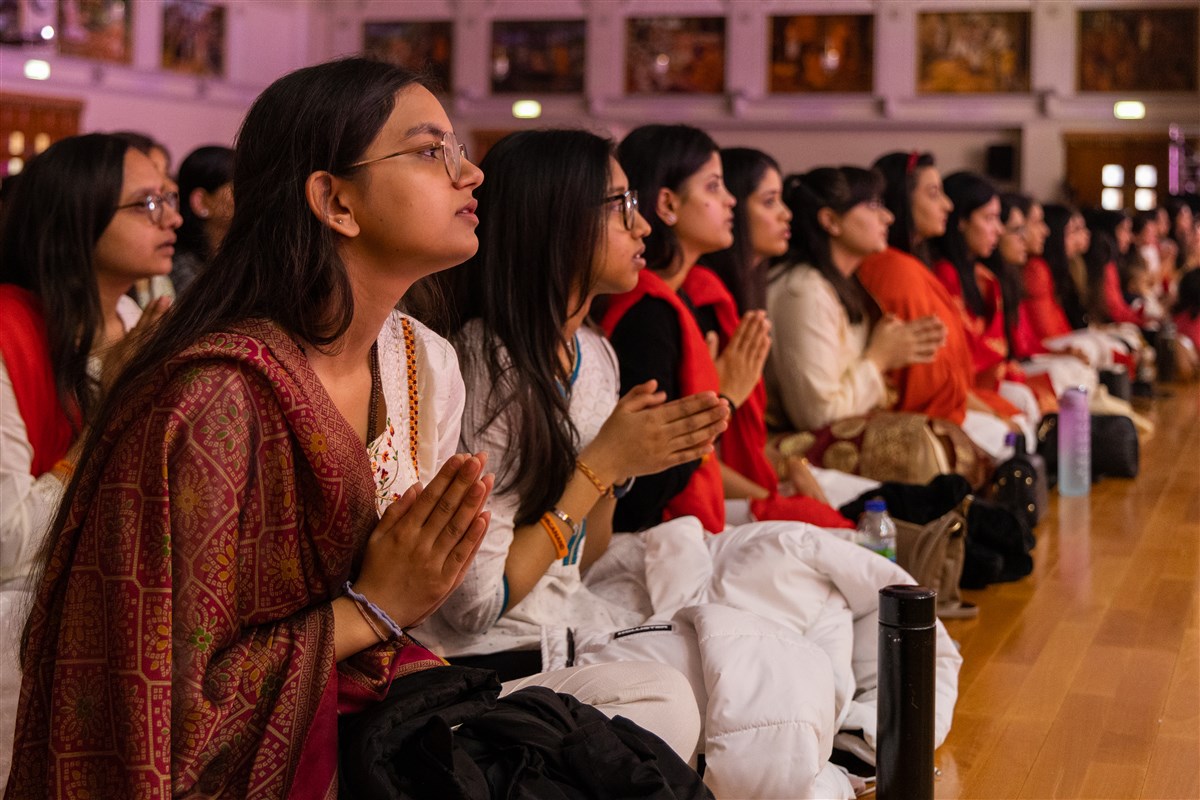 Devotees respond with folded hands