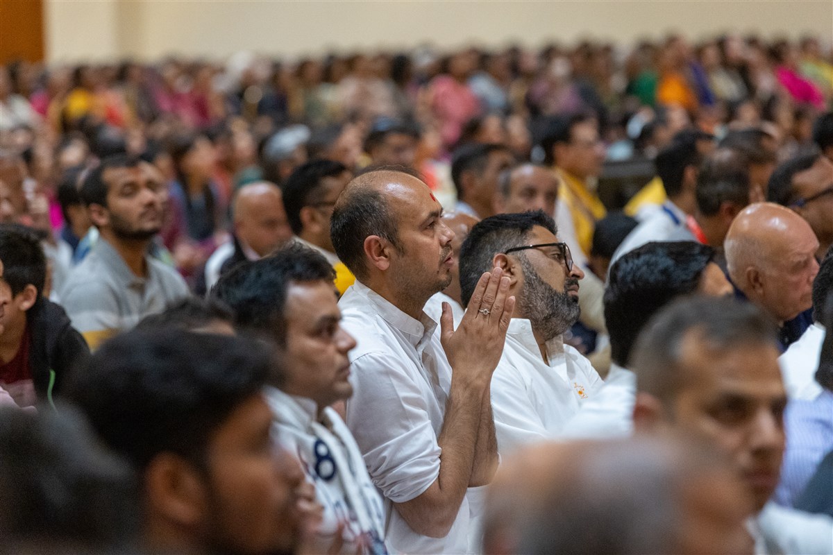 Devotees join in the prayer