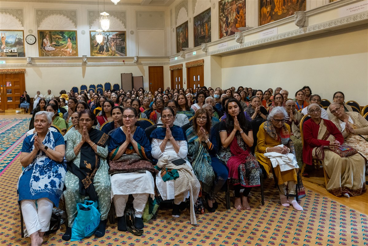 Devotees respond with folded hands