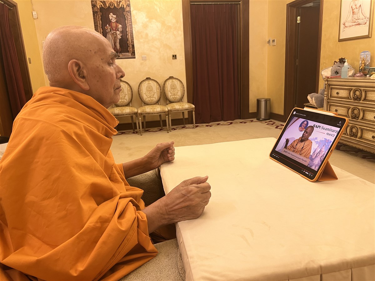 Swamishri watching the evening sabha programme for Europe Din