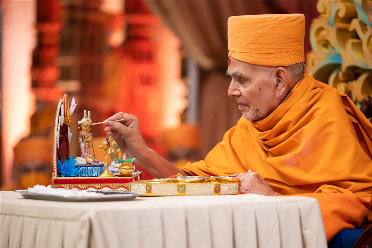 As a part of the diksha mahotsav ceremony, Swamishri performs the pujan of Shri Harikrishna Maharaj...