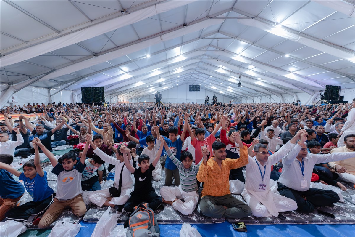 Devotees joins hands in a gesture of unity
