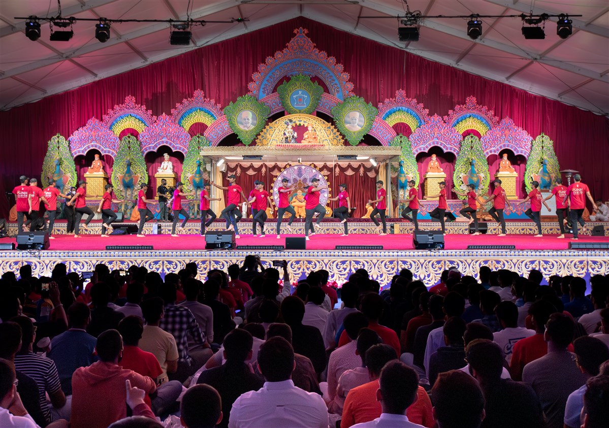 Youths perform a devotional dance in the evening assembly