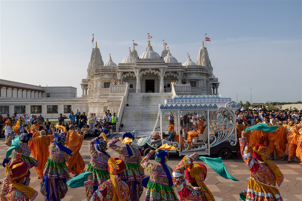 Children present a traditional dance during the Rathyatra procession