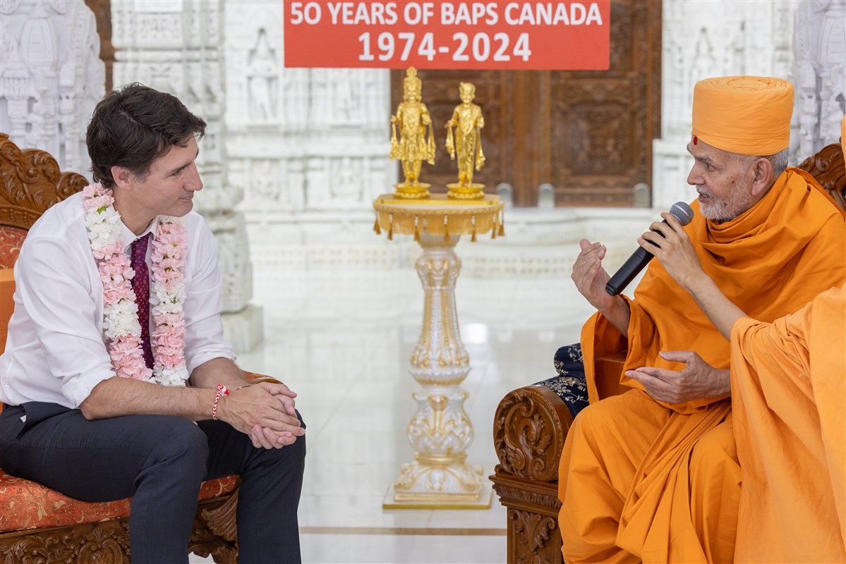 Swamishri is in an engaged conversation with the Prime Minister