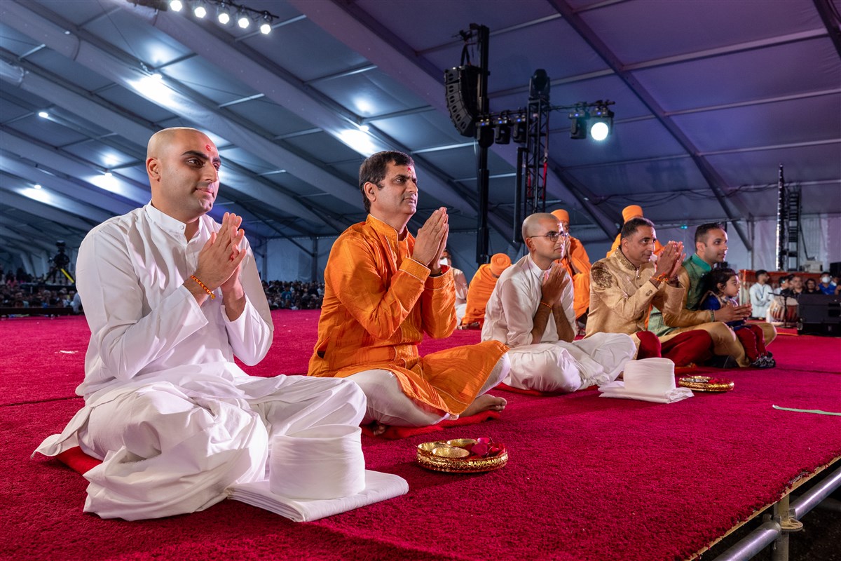 The sadhaks and their family members participate in the diksha ceremony