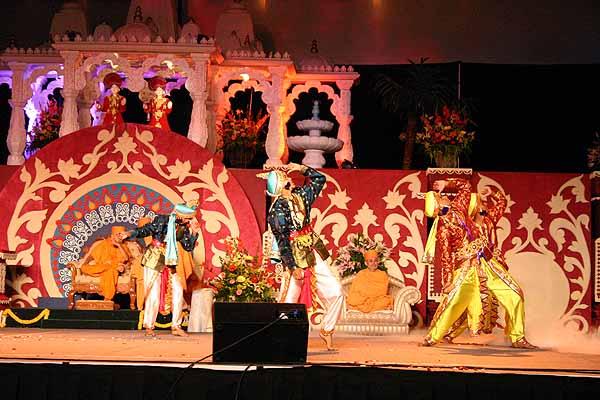 Youths dance joyously in front of Swamishri