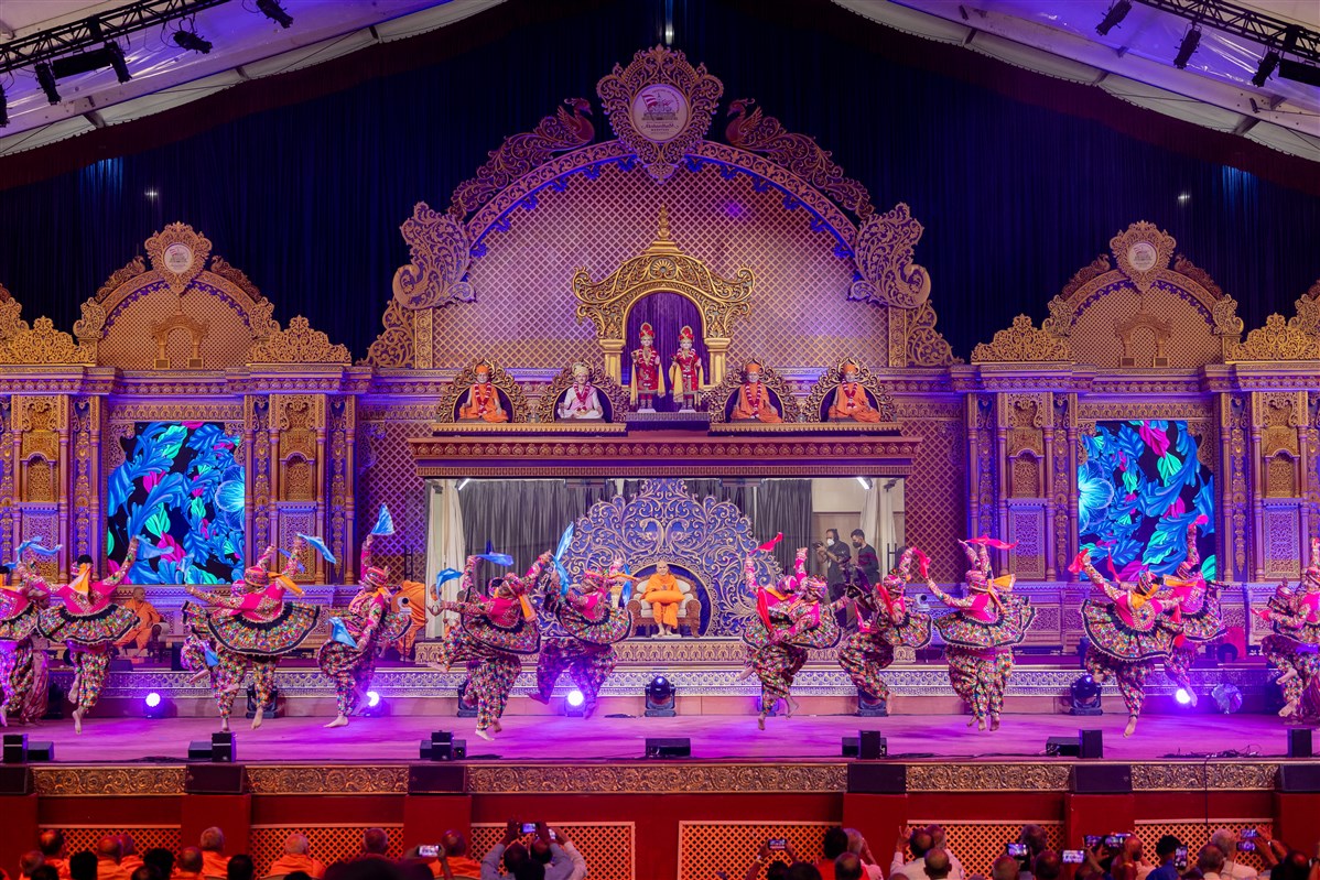 Akshardham volunteers present a vibrant dance during the 'Festival of Inspirations' launch assembly