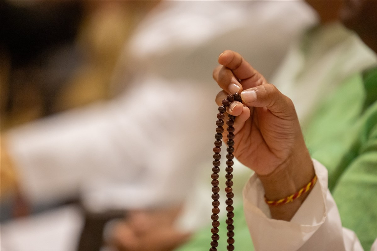 A devotee turns the rosary