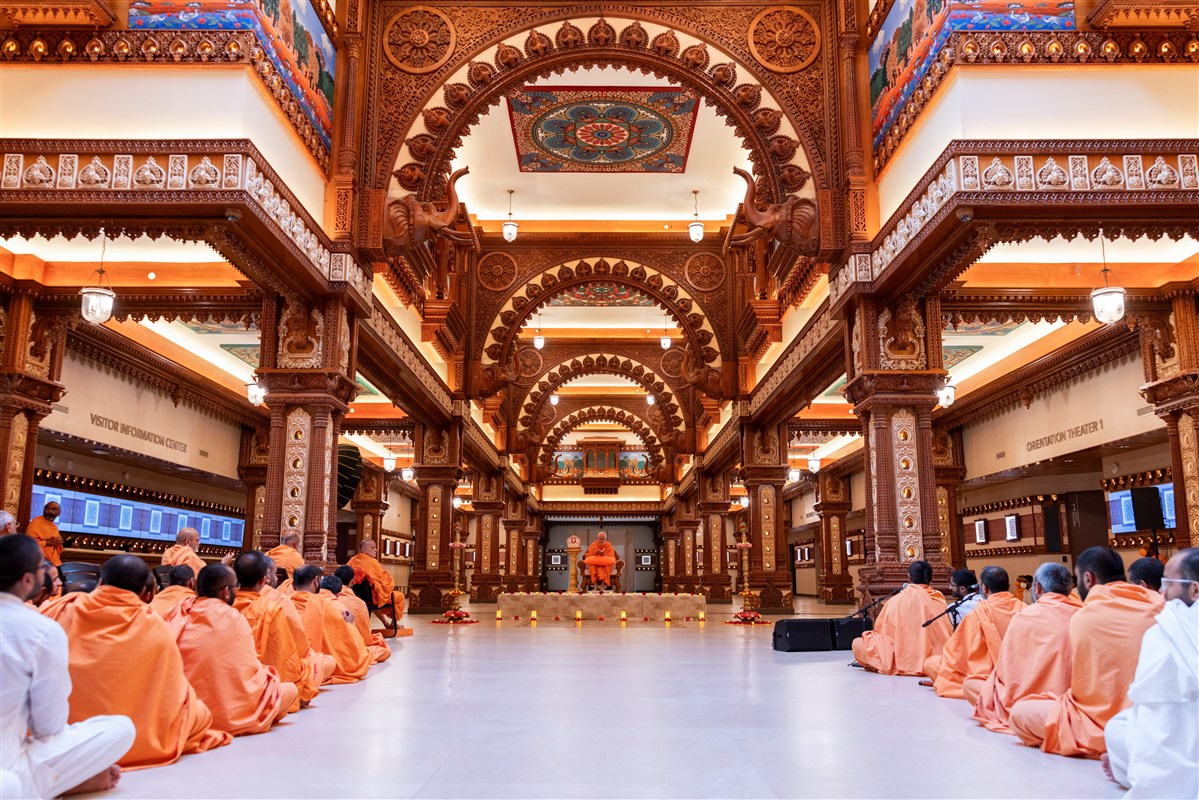 A unique view of Swamishri performing puja in the Welcome Center