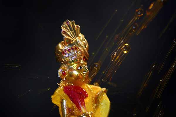 Evening ,Swamishri sprays Shri Harikrishna Maharaj with colored water 