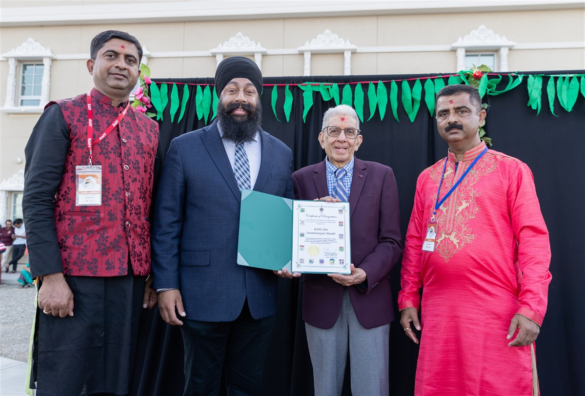 Jasraj Singh Hallan, Member of Parliament for Calgary Forest Lawn presenting a certificate of recognition