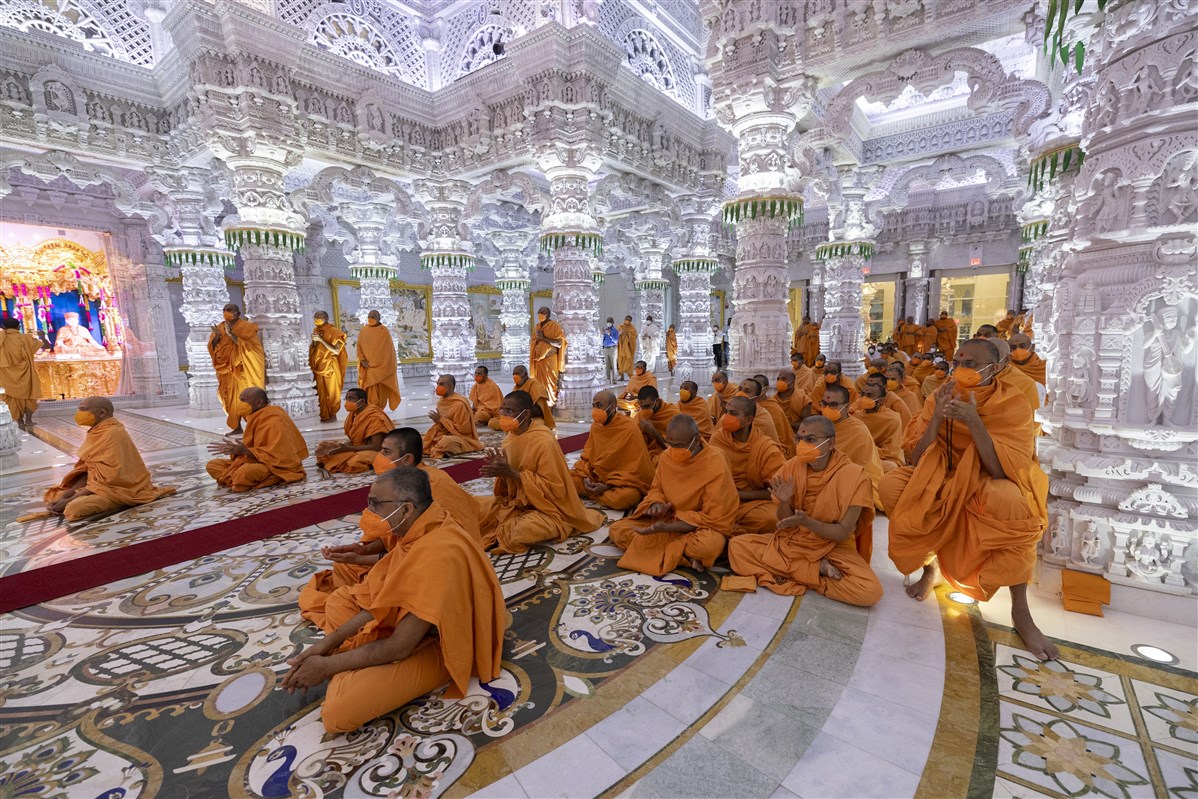 Swamis participate in the morning arti