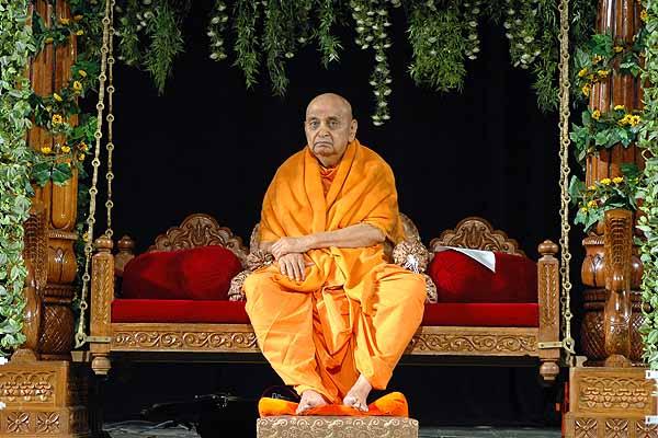  Evening ,Swamishri sits on a swing to mark the beginning of the Hindolo Utsav 
