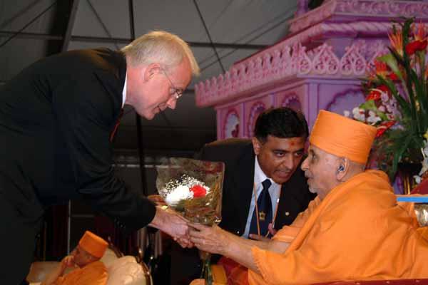 Representative John J. Millner greets Swamishri 	