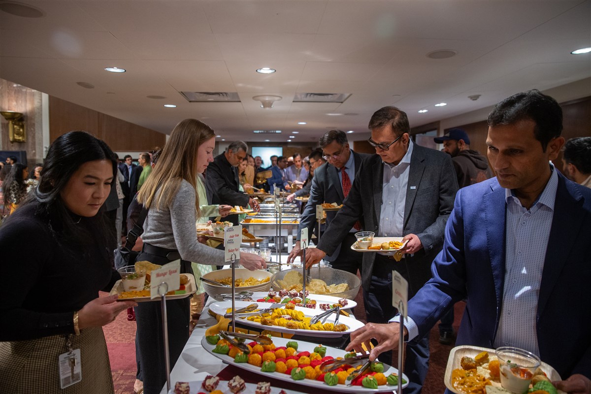 Attendees enjoy traditional Indian foods and sweets