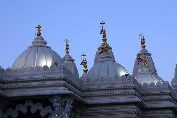 The lighted domes of the Mandir