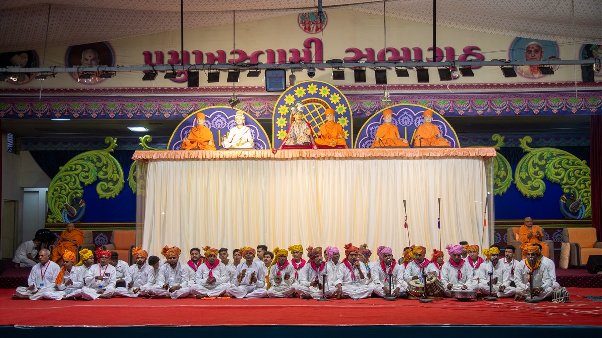 Devotees sing kirtans in traditional style in the assembly