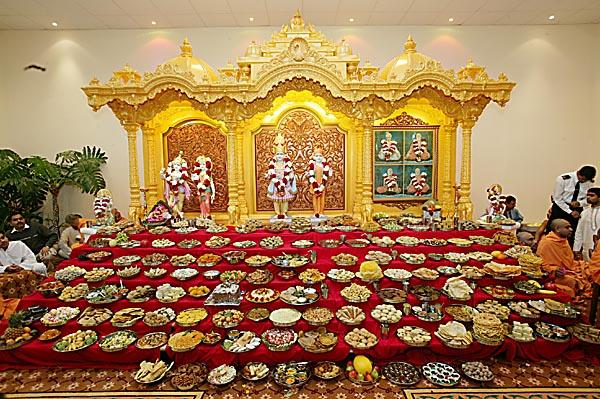   Annakut is offered to the sacred images of Akshar Purushottam Maharaj, Radha Krishna Dev and Guru Parampara
