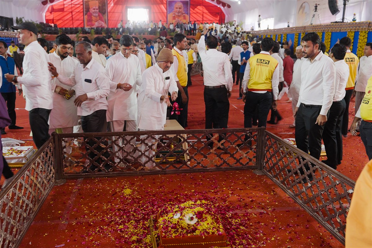 Devotees shower flower petals in the foundation