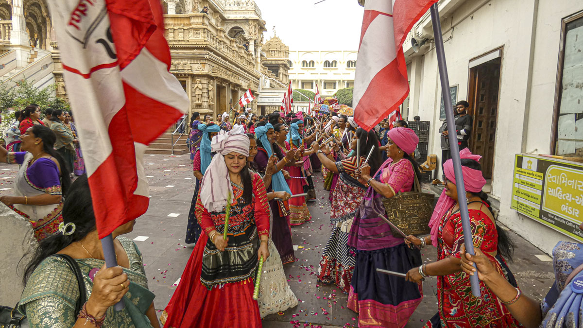 Balika karyakars perform folk dances as part of the procession