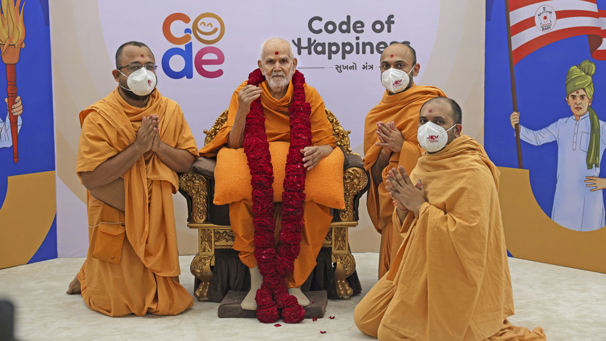 Sadhus from the national office welcome Mahant Swami Maharaj to the shibir