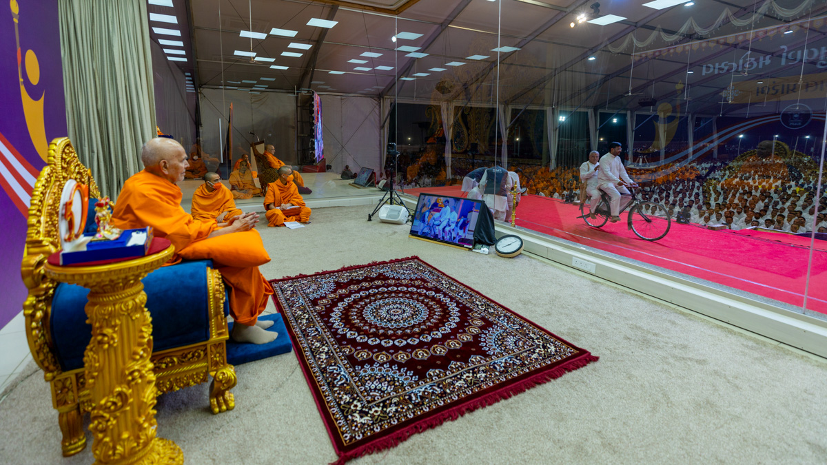 Swamishri watches a skit performed by karyakars