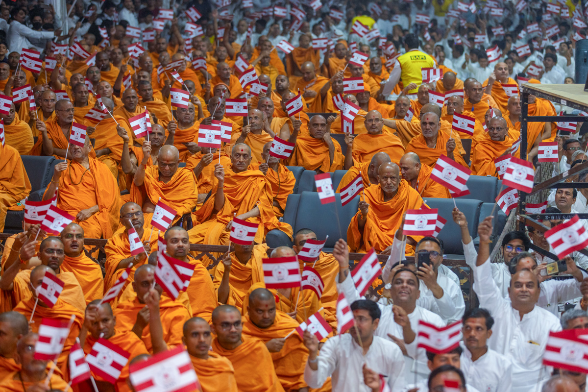 Swamis and karyakars wave BAPS flags