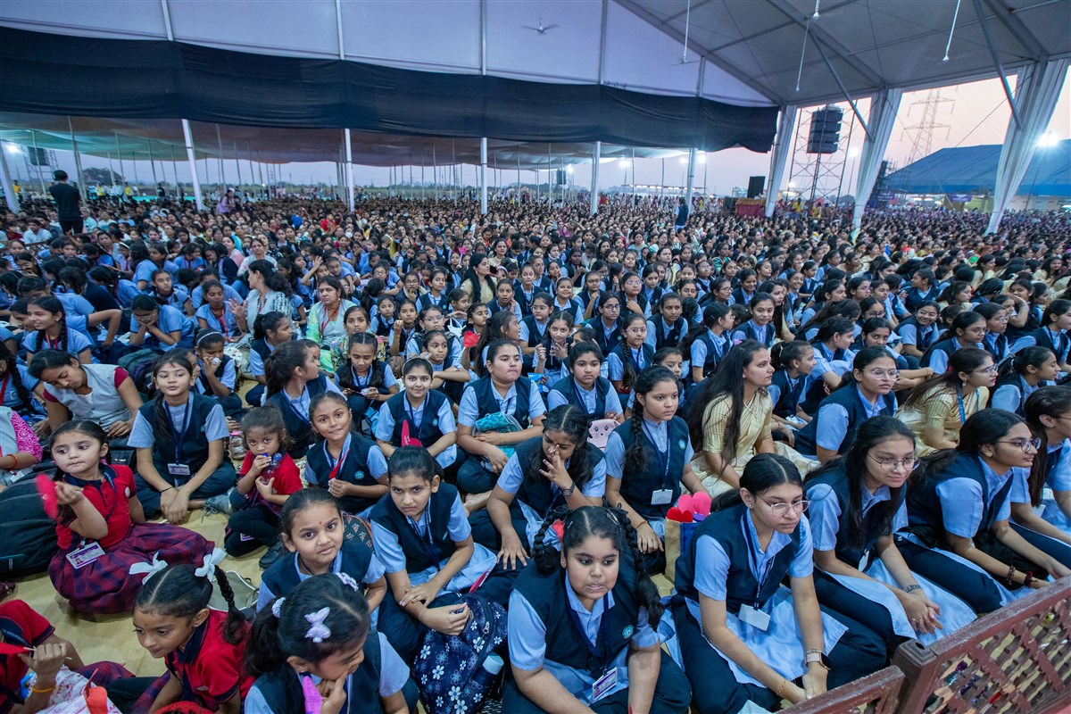 Students and devotees during the assembly