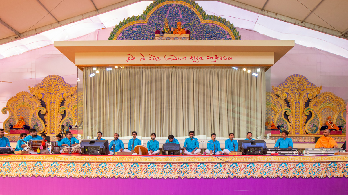 Youths sing kirtans at the beginning of the evening satsang assembly