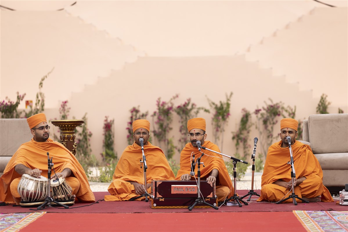 At the Mandir site, swamis began the welcome assembly with devotional singing
