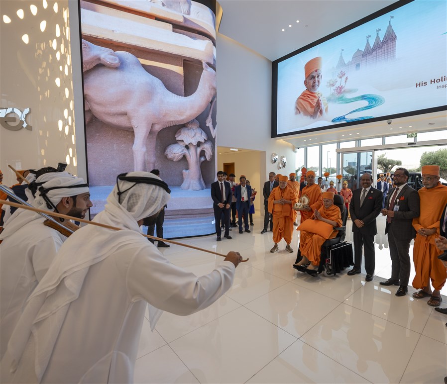 The Al-Ayyala performers dance again for Swamishri before he departs the airport