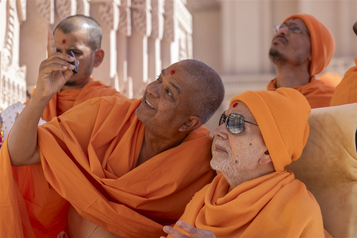 Swamishri listens intently to Brahmaviharidas Swami as he explains various features of the mandir