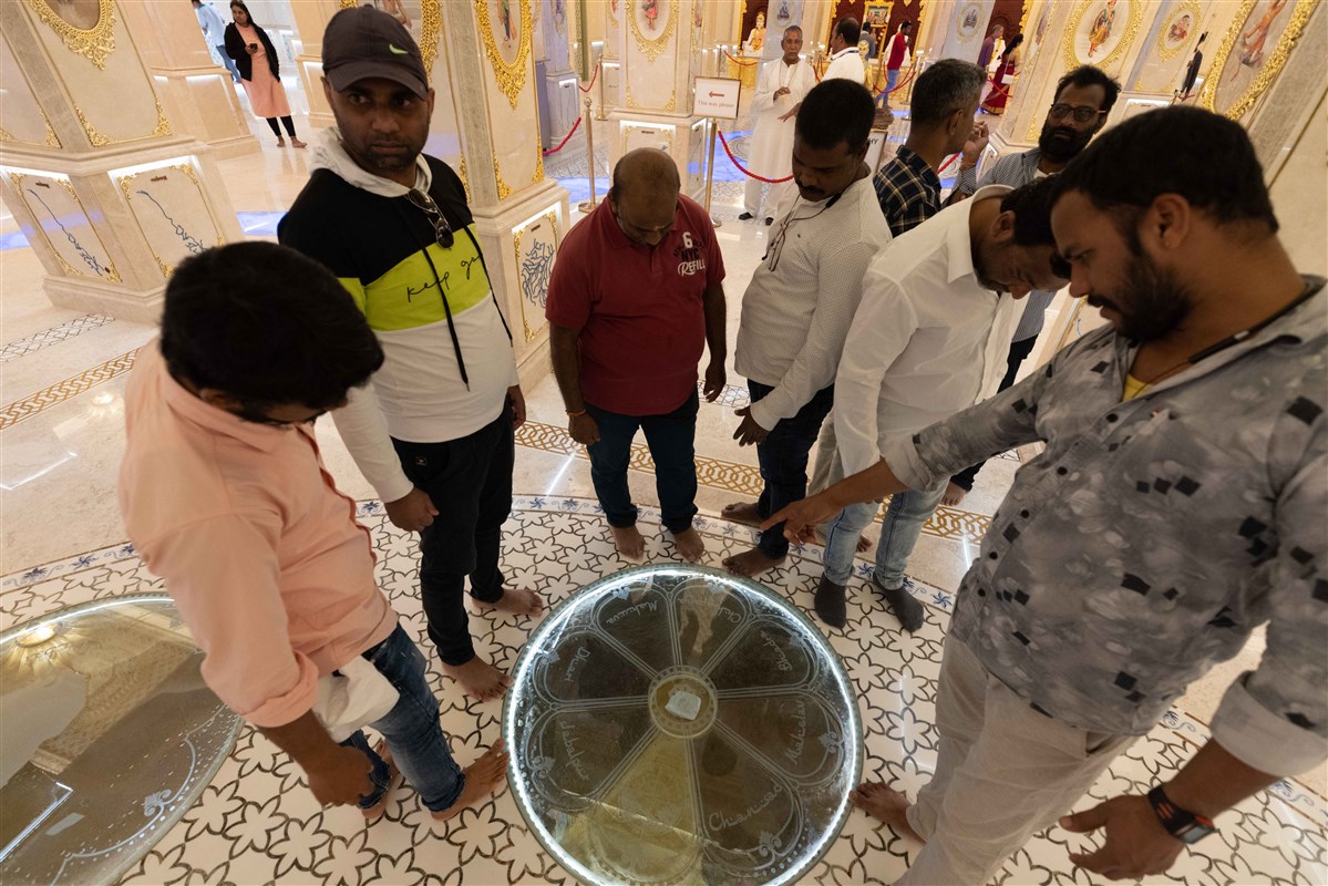 Pilgrims in the abhishek mandap noted the sacred soil enshrined in the floor