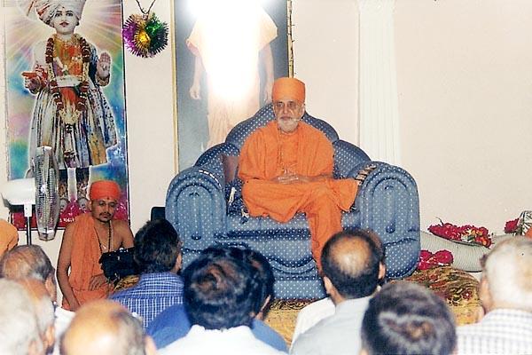 Addresses the satsang assembly in mandir