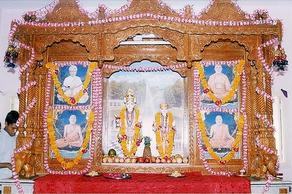 Shri Akshar Purushottam Maharaj and Guru Parampara in the mandir sinhasan