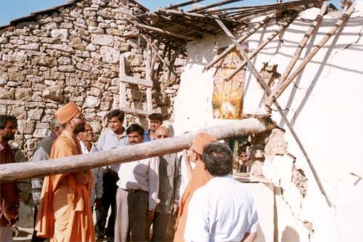  Sadhus and volunteers surveying the calamities