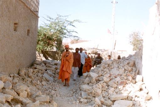 Sadhus and volunteers surveying the calamities