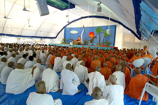 Devotees engaged in darshan of Swamishri's puja