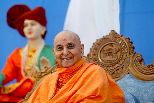 Happily responds during a satsang assembly