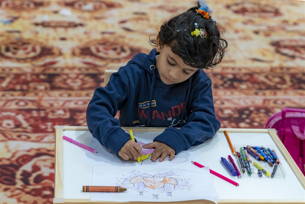 Balika immersed in an activity filled with colors and creativity