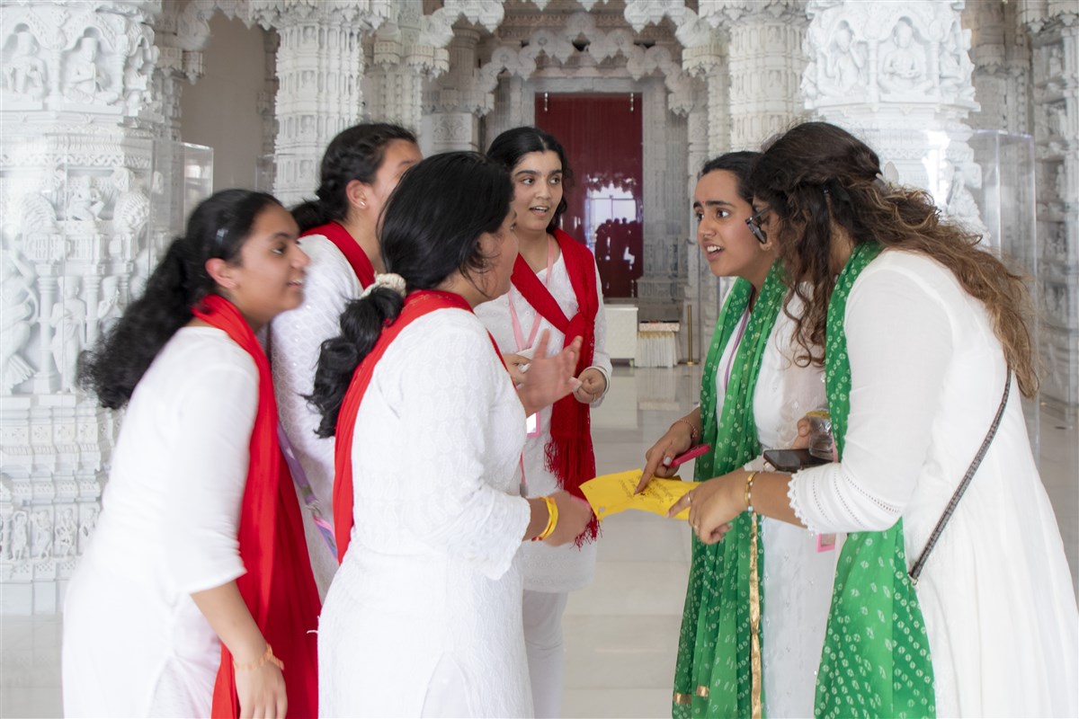 Teenagers look for the clues of the treasure hunt based on the various features of the mandir
