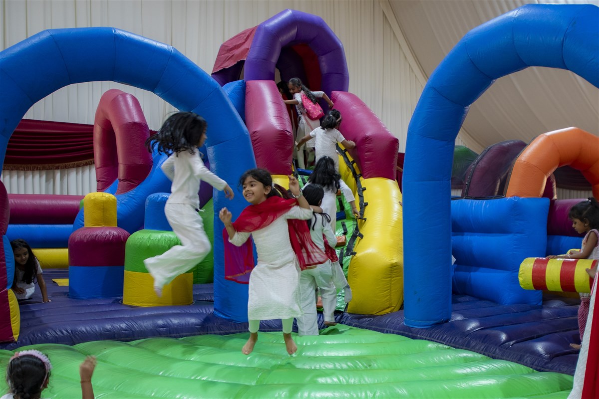 Young children enjoying themselves at the Bouncy Castle